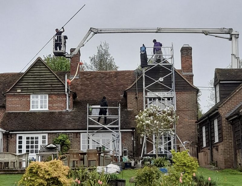 The Roof Moss Cleaners using cherry picker and scaffolding to clean roof safely and professionally in Henley-on-Thames, Oxfordshire