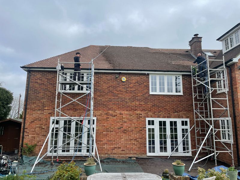 Roof cleaning carried out safely from scaffold towers by The Roof Moss Cleaners in Henley-on-Thames